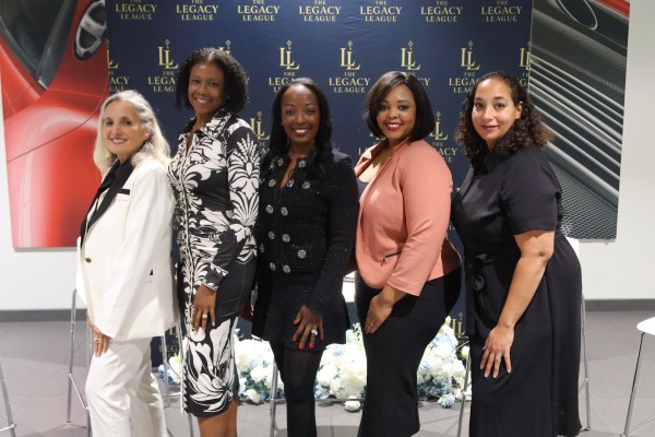 The Legacy League Women's Legal Playbook panelists and host at Porsche Chantilly, a women in business legal event