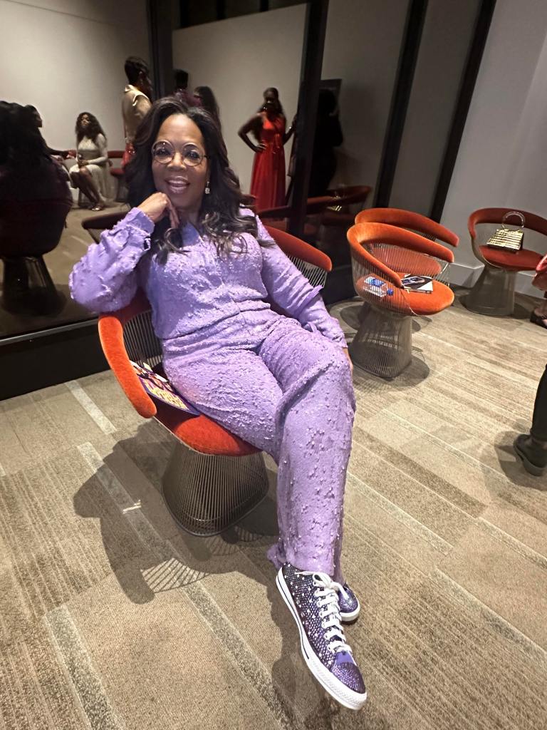Custom purple rhinestone sneakers with Oprah written on the laces, designed by UniqueLee Creations