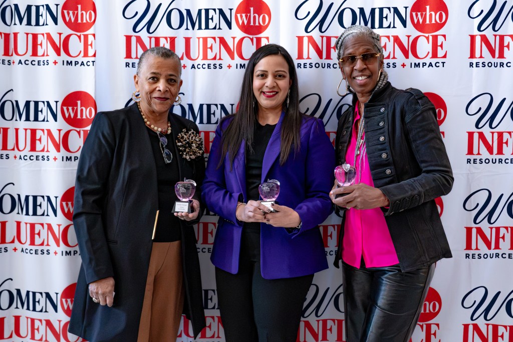 Guests at the step and repeat for the 2026 Pink Apple Awards hosted by Women Who Influence at Brooklyn Borough Hall